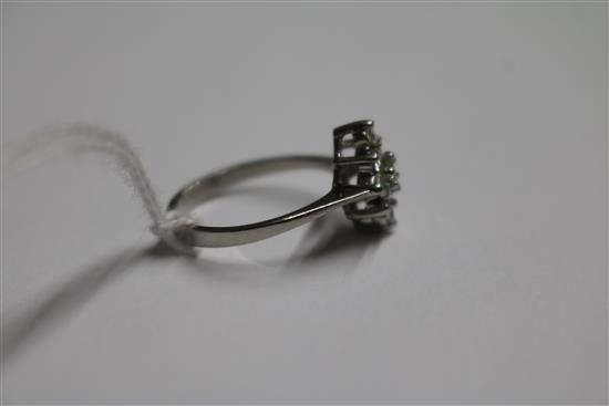 A platinum and lozenge shaped diamond cluster ring, size L/M.